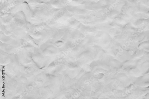 Abstract background from white clay texture on wall. Monochrome art wallpaper.