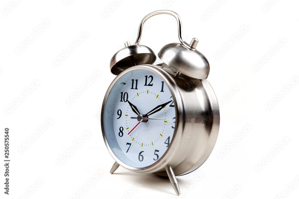 Stainless steel old fashioned alarm clock on a white background Stainless steel old fashioned alarm clock on a white background