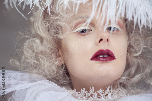Fototapeta Naklejka Na Ścianę i Meble -  Young attractive woman with platinum blonde and purple lipstick