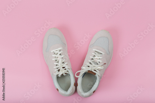 Overhead Shot Of White Sneakers On colored Background