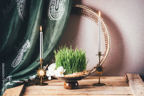 Novruz still life with semeni sabzi wheatgrass , silk national scarf, eastern musical instrument and orchids. Spring equinox in March celebration, copy space  photo