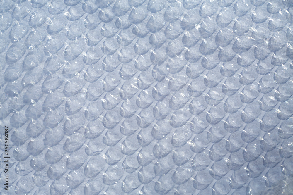Blurred Plastic Bubble Cushioning Wrap surface texture on white background, Light & Shadow concept Blurred Plastic Bubble Cushioning Wrap surface texture on white background, Light & Shadow concept