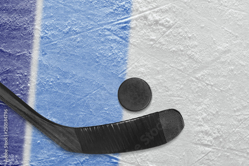 Blue lines and hockey stick with puck