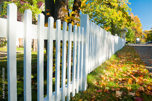 Beautiful colorful autumn scene with white fence and fall colors in Finland. photo