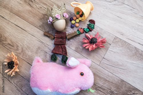 Easter, preparation for Easter, still life, story for Easter, eggs, colored objects, flowers, wooden background, wreath,