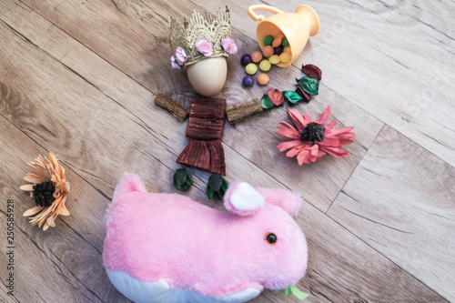 Easter, preparation for Easter, still life, story for Easter, eggs, colored objects, flowers, wooden background, wreath,