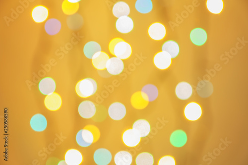 abstract blurred lights on background in green, orange and blue- christmas celebration concept