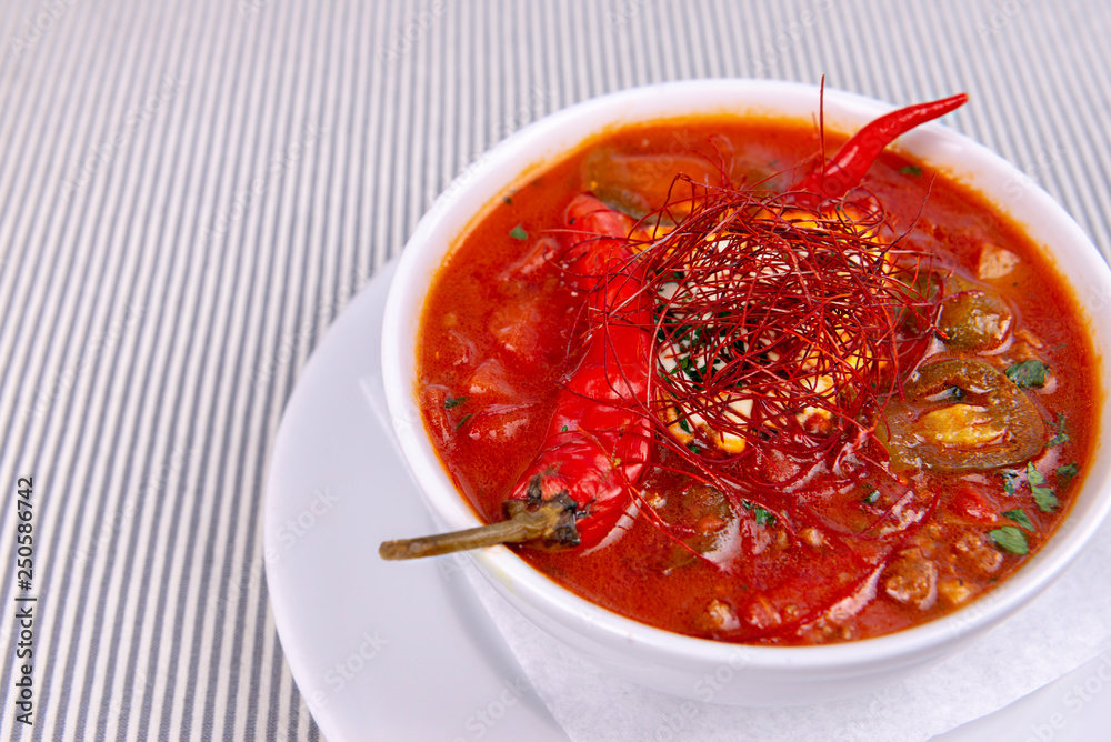 Hot red spicy soup served in restaurant Hot red spicy soup served in restaurant