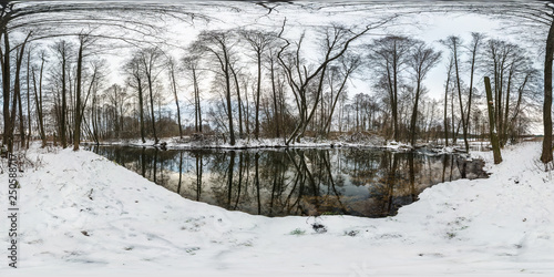Winter full spherical hdri panorama 360 degrees angle view road in a snowy forest near river with gray pale sky in equirectangular projection. VR AR content