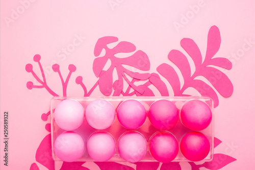 Easter 2019 with eggs painted in pink color on a monochrome background