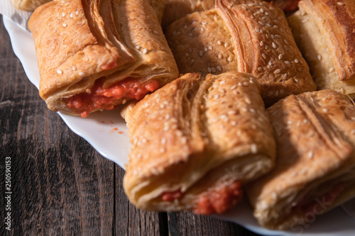 Homemade bannock from puff pastry with pizza filling photo