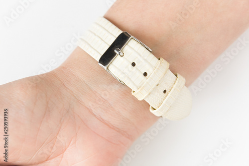 Old tacky watch strap on a woman's wrist. photo