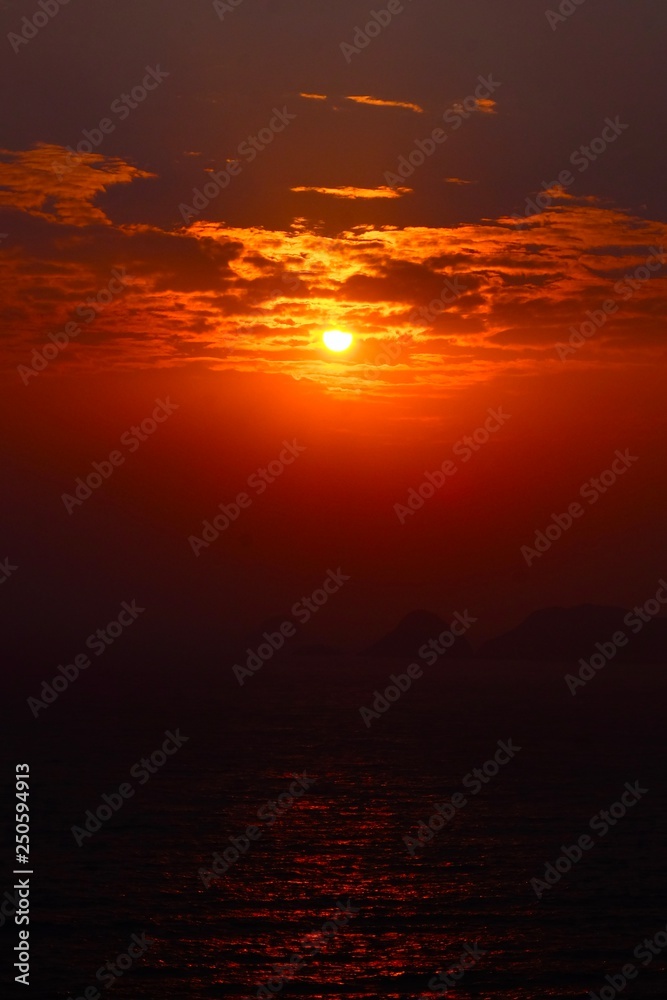 Beautiful sunrise image with colorful blue purple orange sky and white cloud with seascape landscape background