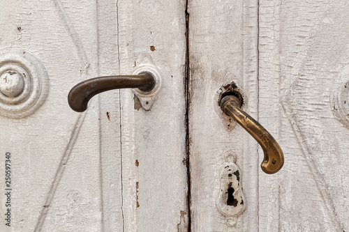 Two old broken door handles