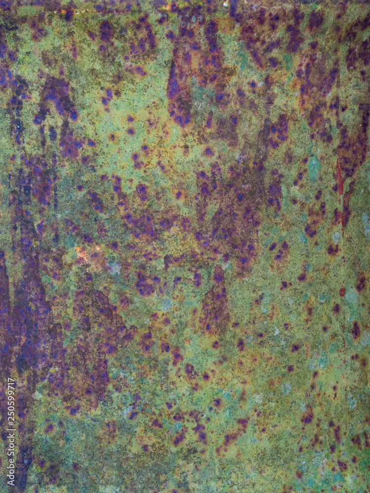 Old sheet of iron covered with a red-brown color with old green stained paint decaying metal, grunge background