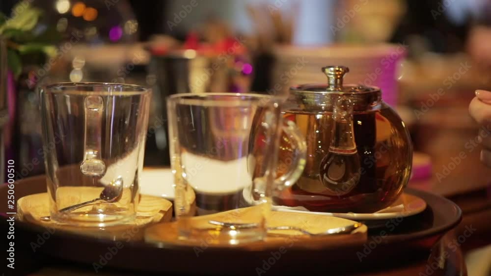 Hot English brewed tea in teapot, breakfast in a cafe. Hot English brewed tea in teapot, breakfast in a cafe.