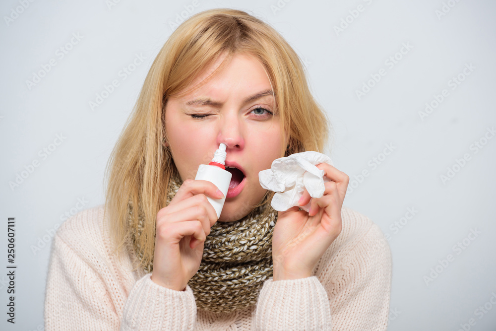 Nasal spray runny nose remedy. Girl sick person hold nasal drops and