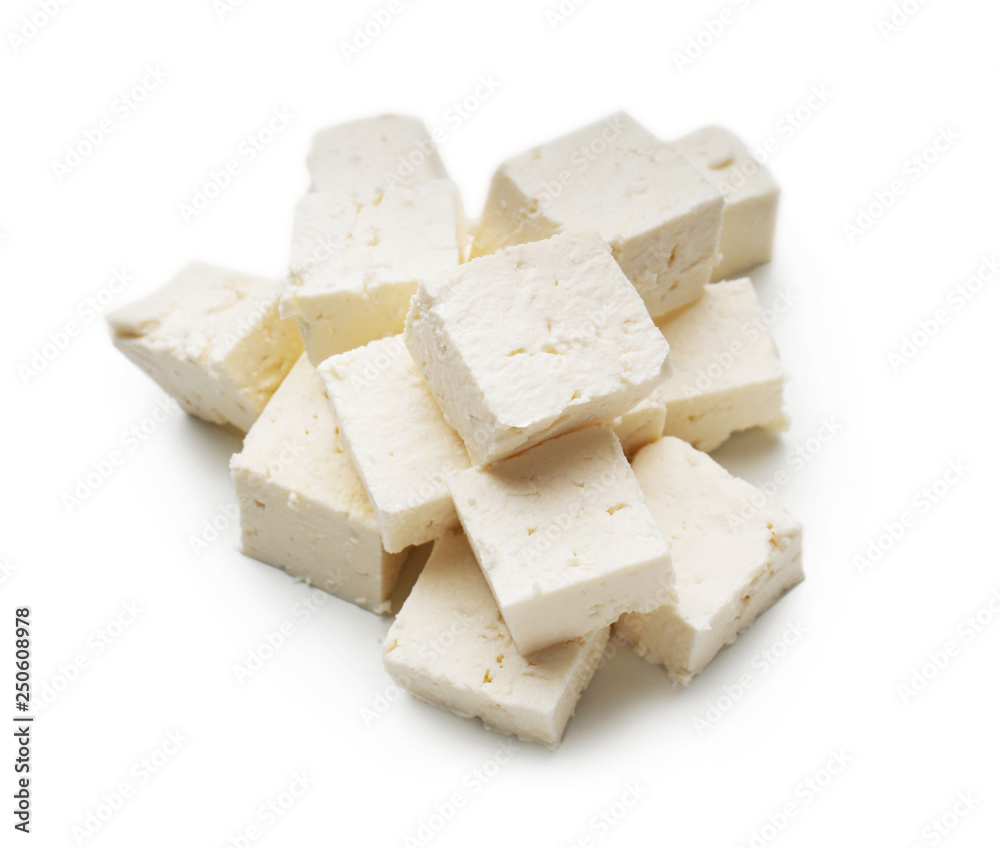 Pieces of tasty feta cheese on white background