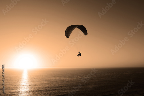 Paragliding At Sunset
