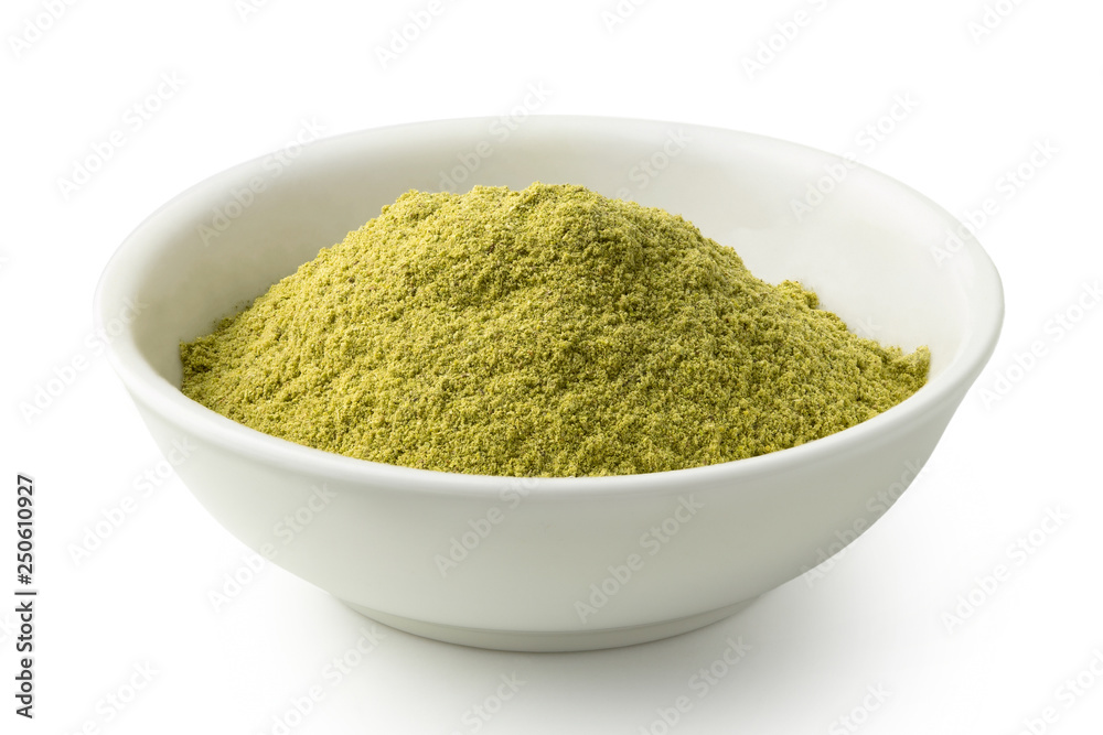 Ground rosemary in a white ceramic bowl isolated on white. Ground rosemary in a white ceramic bowl isolated on white.