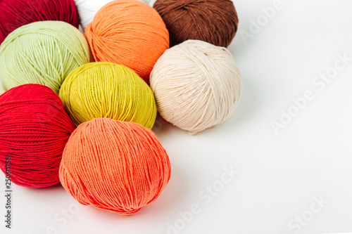 Colorful yarn for knitting on White background.
