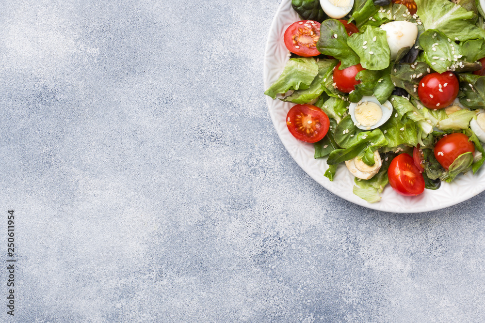 Fresh salad with tomatoes and quail eggs and lettuce. Copy space Fresh salad with tomatoes and quail eggs and lettuce. Copy space