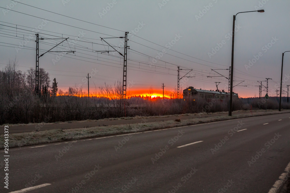 Morning train at beautiful sunrise in Finland