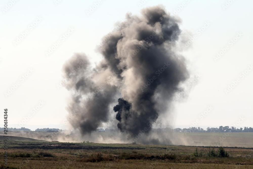 The explosion of a combat charge at the site during the battle, military action, the conflict between Ukraine and Donbass