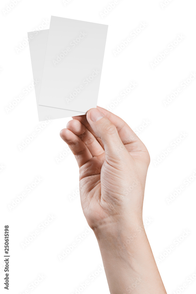 Male hand holding two blank sheets of paper (tickets, flyers, invitations, coupons, banknotes, etc.), isolated on white background Male hand holding two blank sheets of paper (tickets, flyers, invitations, coupons, banknotes, etc.), isolated on white background