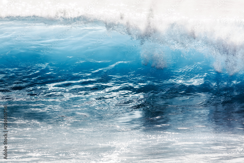 Obraz premium Beautiful seascape view of the big blue surf waves of the Atlantic ocean on the island Madeira, a popular surfing tourist destination