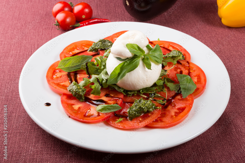 Italian burrata cheese served with sliced tomatoes