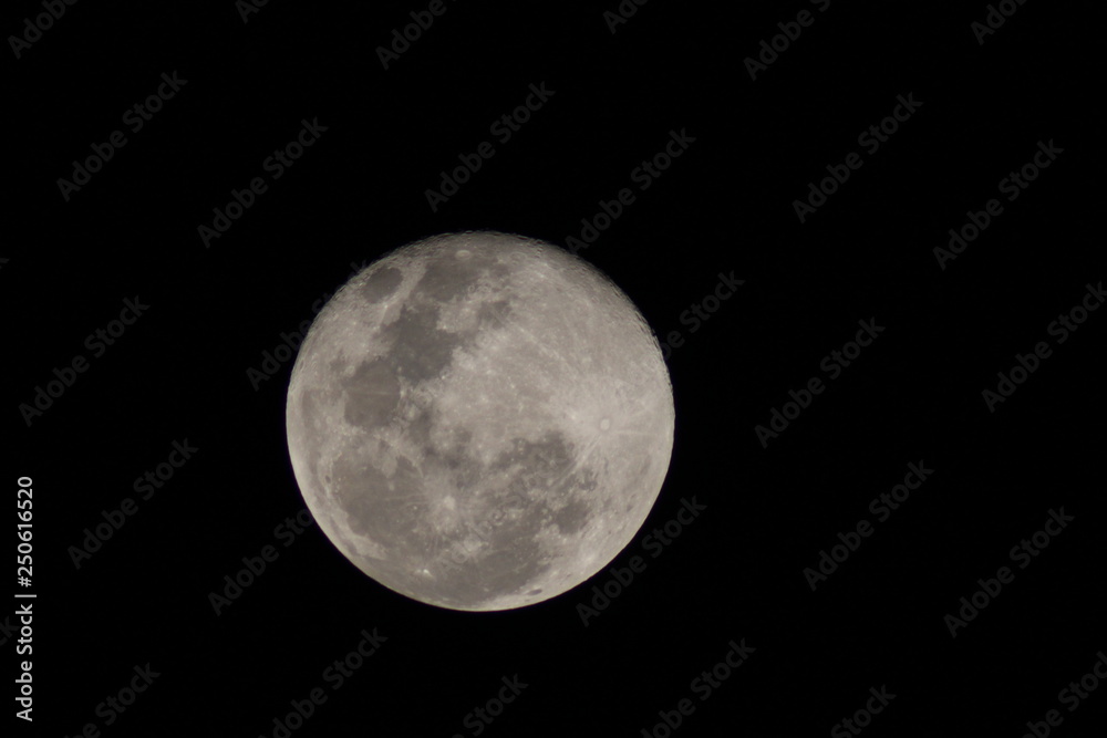 First moon after the full moon with distinct craters visible on the upper edge First moon after the full moon with distinct craters visible on the upper edge