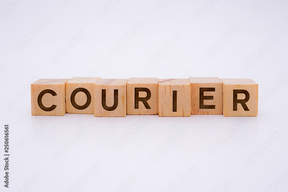 Courier Word Written In Wooden Cube Courier Word Written In Wooden Cube