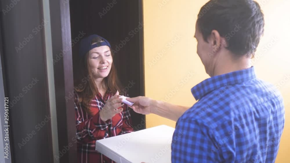 pizza delivery concept. woman delivers a box of pizza to the man . slow motion video. fast food concept fast food lifestyle delivery