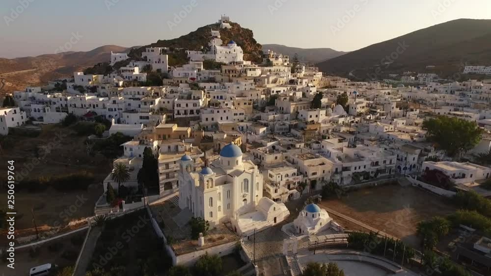 Aerial bird's eye view video taken by drone of beautiful chora main village of Ios island at sunset, Cyclades, Greece Aerial bird's eye view video taken by drone of beautiful chora main village of Ios island at sunset, Cyclades, Greece