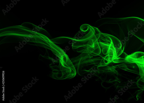 Green smoke abstract on a black background, darkness concept