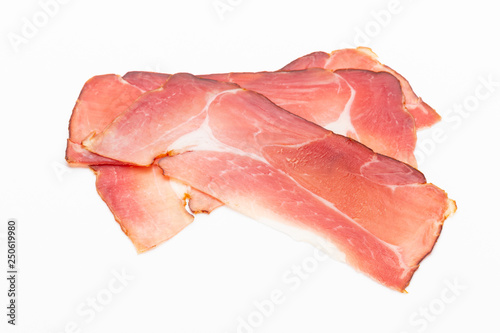 Hamon sliced on white background. Spanisch traditional meat.