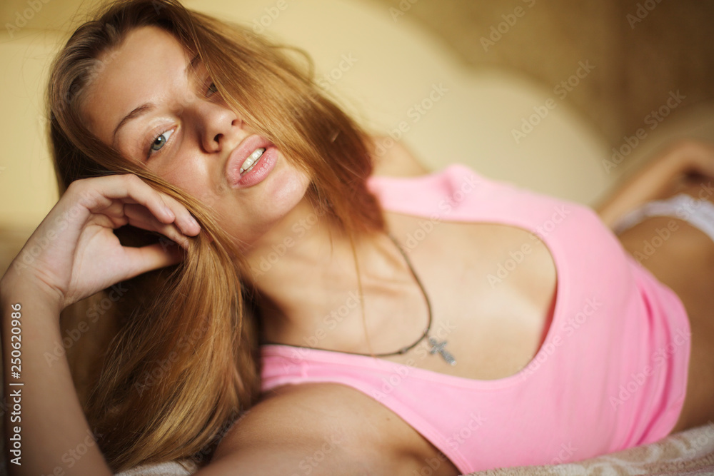 Fototapeta premium Amazing redhead girl posing at home studio