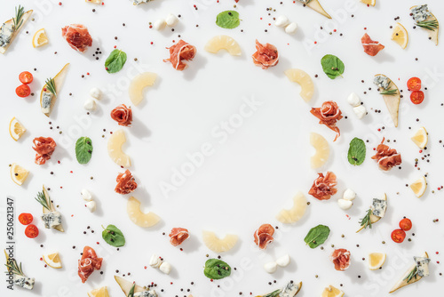 flat lay of tasty prosciutto healthy organic ingredients and spices on white background