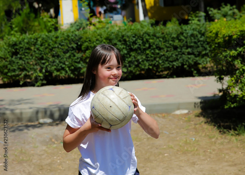 Little girl have fun with a ball