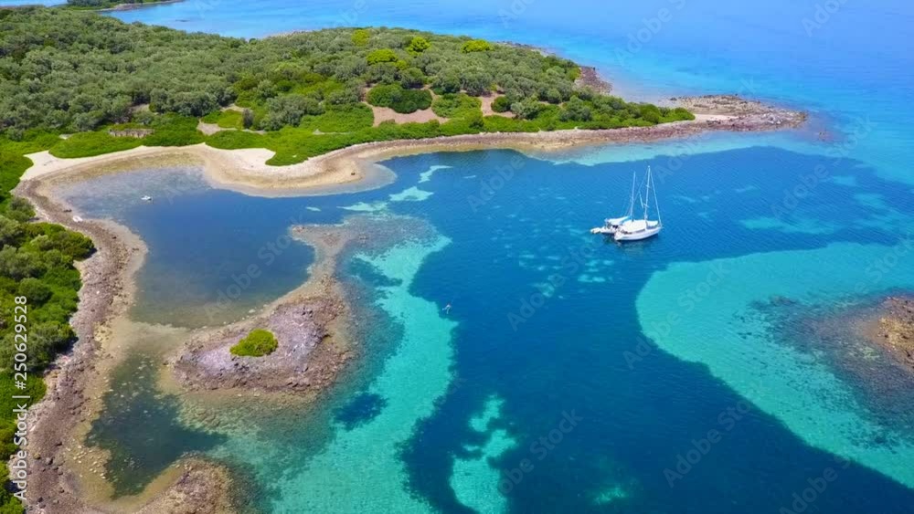 Aerial view video from famous organised beach in small island of Monolia part of archipelago paradise exotic islands of Lihadonisia with clear turquoise sea beaches, North Evoia island, Greece Aerial view video from famous organised beach in small island of Monolia part of archipelago paradise exotic islands of Lihadonisia with clear turquoise sea beaches, North Evoia island, Greece