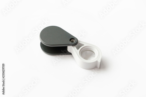 Magnifying glass for diamonds or see the amulet Isolated on a White Background.