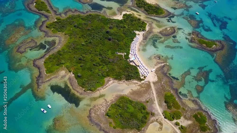 Aerial view video from famous organised beach in small island of Monolia part of archipelago paradise exotic islands of Lihadonisia with clear turquoise sea beaches, North Evoia island, Greece