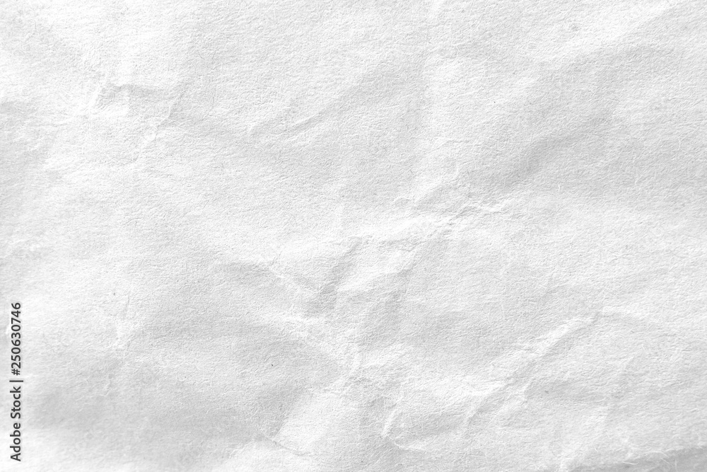 Naklejka premium White crumpled paper texture background. Close-up.