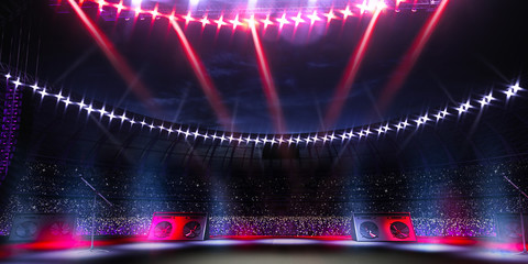 Empty main stage big music festival. Aroun full stadium of spectators. fans are holding flashlights.
