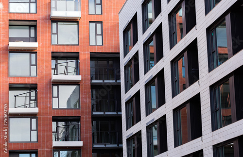 View on tnew construction brick apartment complex square windows. Modern Apartment Complex Under Construction photo