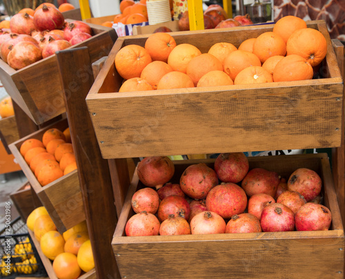 Fruit bench selling oranges and pomegranates