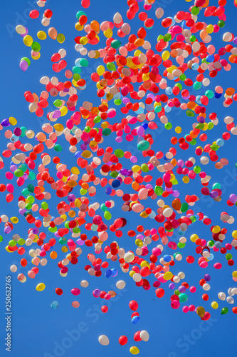 Colorful balloons in the blue spring sky.