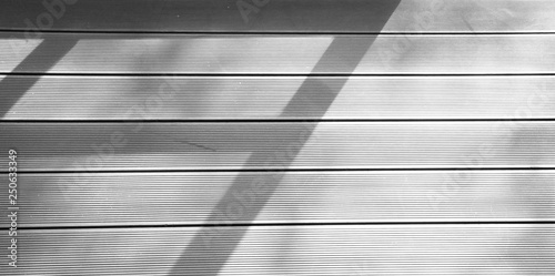 window shadow on wood floor background - monochrome