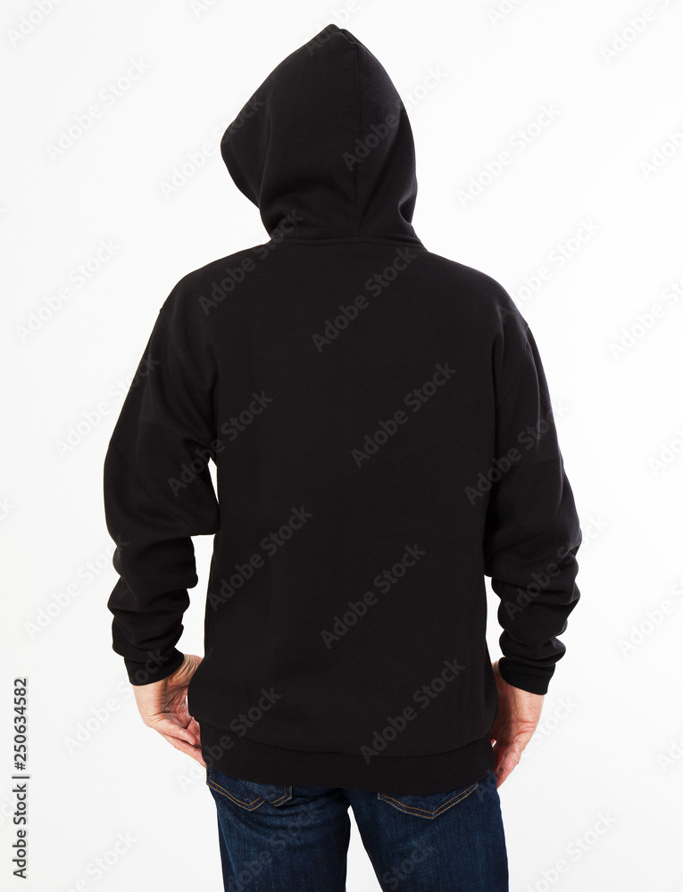 man in a black sweatshirt with a hood on his head is isolated on a white background - back view, top view